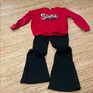 Vibrant Red Swiftie Sweatshirt and black flare pants